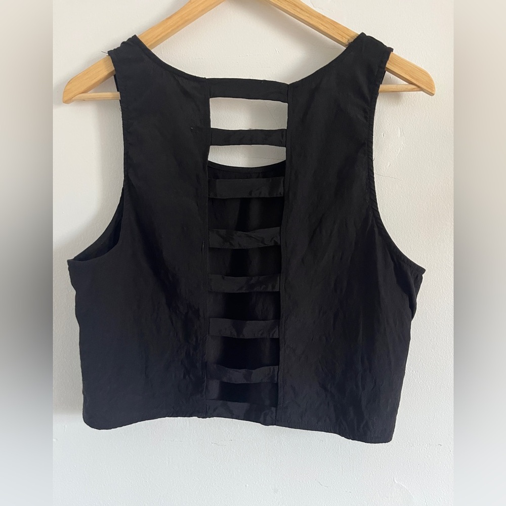 Edgy black cropped blouse with stepped cut outs